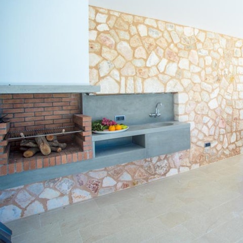 Prepare a feast in the outdoor kitchen, where you can grill fresh produce on the covered barbecue