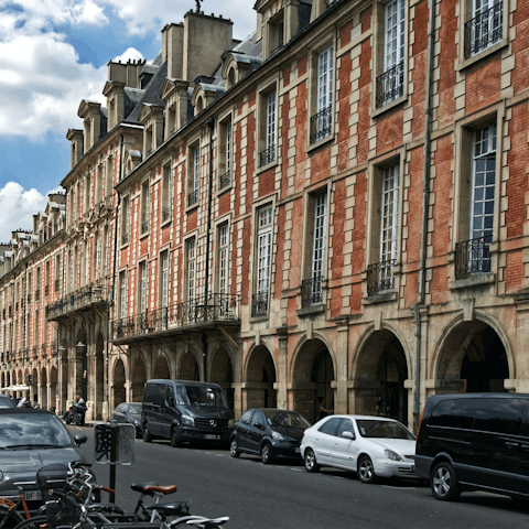 Grab a croissant and breakfast alfresco in nearby Place des Vosges
