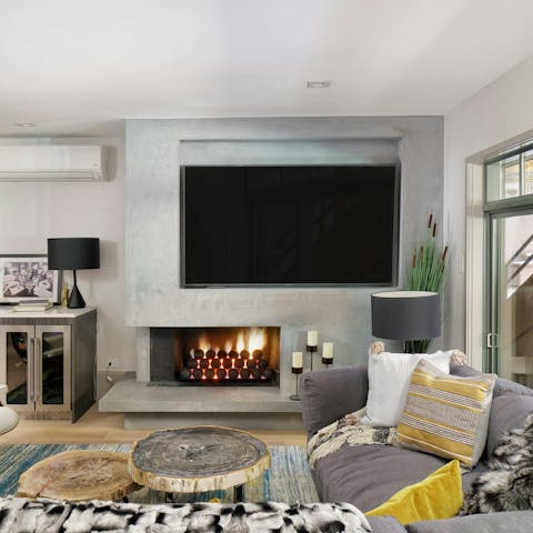 Get cosy in the living area in front of the fire