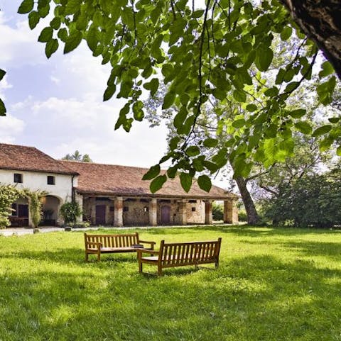 Relax in the leafy green gardens with a book in hand