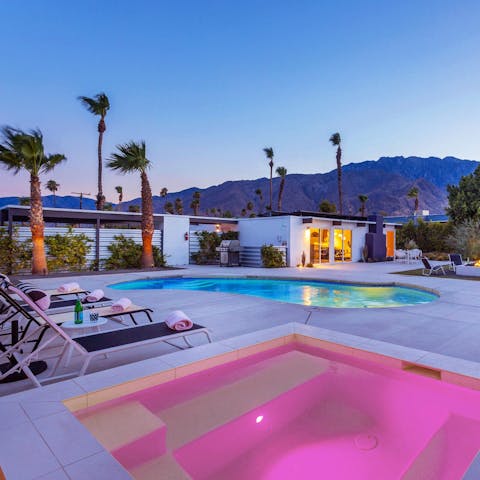 Have a sunset soak in the illuminated pastel pools