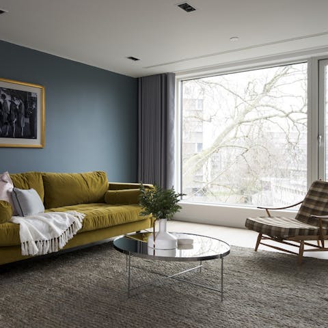 Unwind in a calm living space with stylish moody tones