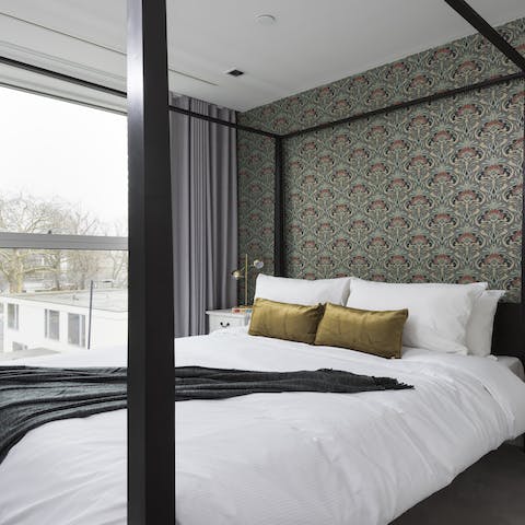 Sleep like royalty in the modern four-poster bed