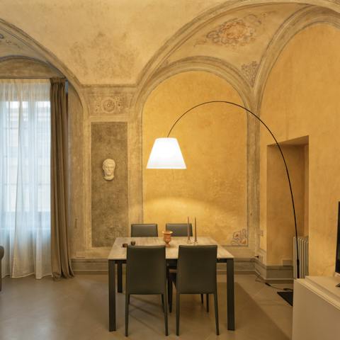 Admire the high vaulted ceilings and antique style of this apartment