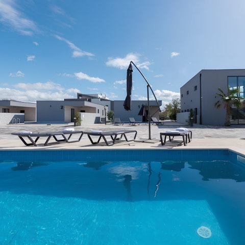 Splash around in the private pool or soak up the sun