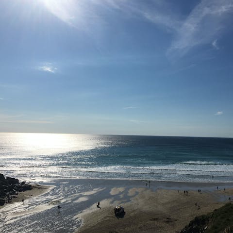 Spend the day building sandcastles on St. Agnes Beach, an eighteen-minute walk away
