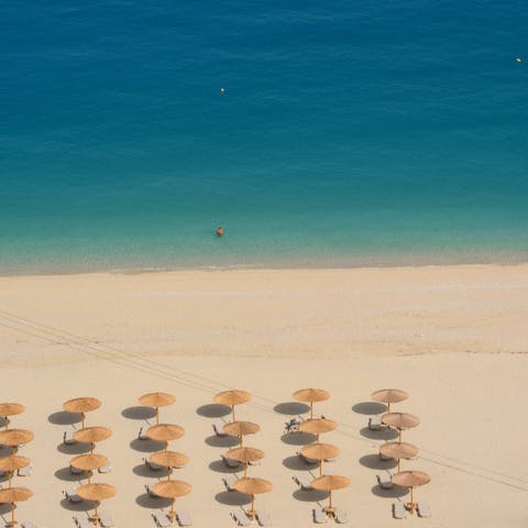 Spend time relaxing on Lourdas beach, just a ten-minute drive from the villa