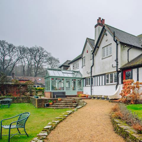 Relax in the luscious gardens overlooking the cricket pitch – is it gin o'clock yet?