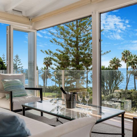 Enjoy some Champagne as you admire the sunset over the bay