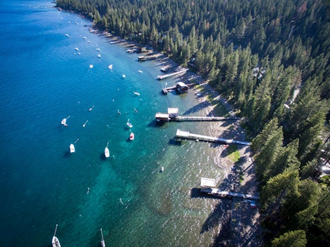 Swim, paddleboard, or kayak in Lake Tahoe's crystal-clear waters, a twenty-minute drive