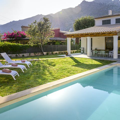 Appreciate the gorgeous landscapes from the comfort of a poolside sun lounger