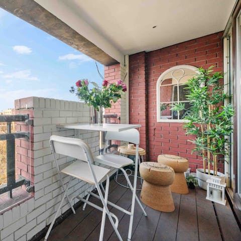 Dine alfresco on the private covered balcony