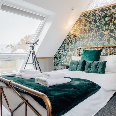 Gaze out at the estate's hay meadow from the pretty master bedroom