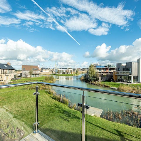 Soak up the lakeside views from the main bedroom's private balcony