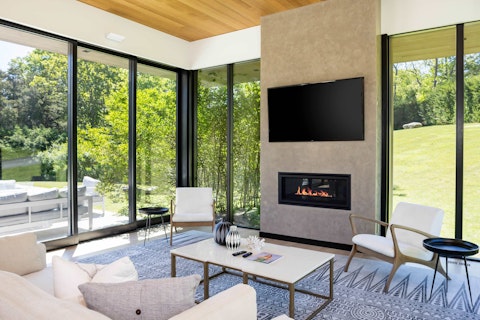 Unwind by the fire with sweeping forest views