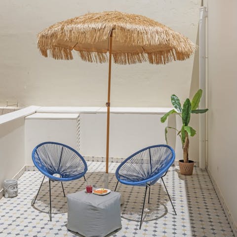Take in a few rays of sunshine on your roomy courtyard veranda