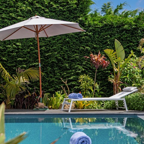 Feel like you've arrived in heaven while lounging by the stunning pool area