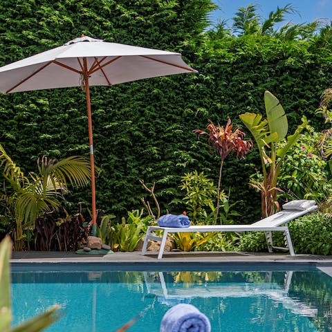 Feel like you've arrived in heaven while lounging by the stunning pool area