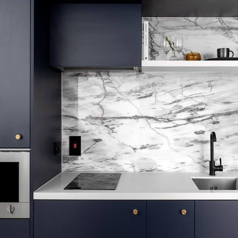 Cook at home in the sleek little kitchen