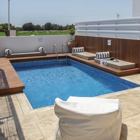 Lounge by the pool all day book in hand