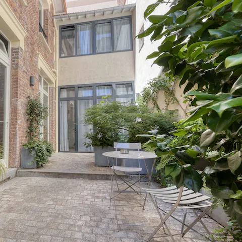 Sip your morning coffee in the shared courtyard