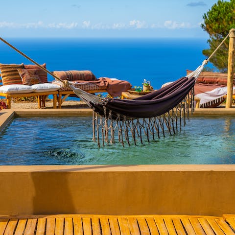 Have an afternoon nap in the hammock hanging over the swimming pool