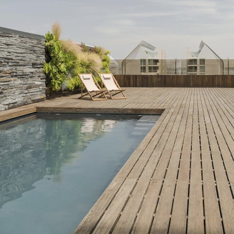 Spend hot afternoons dipping in and out of the communal pool
