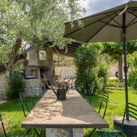 Host alfresco family dinners in the garden, complete with home-grown fruits and vegetables