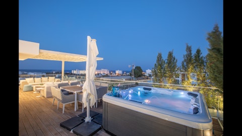 Soak in the lit hot tub as dusk falls over Protaras
