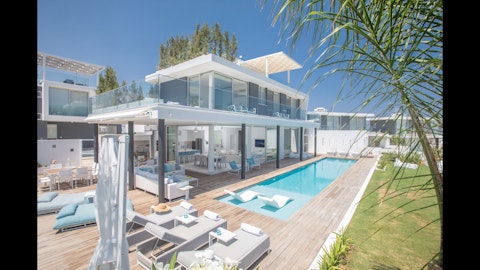 Lap up the sunshine on the timber deck beside a gleaming pool