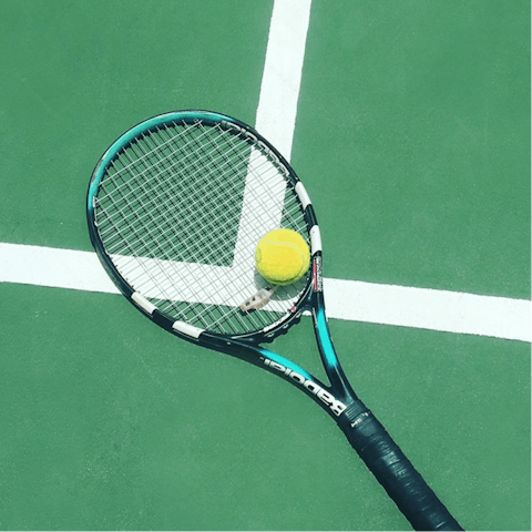 Watch a tennis match at the Roland Garros Stadium, around 500 metres away