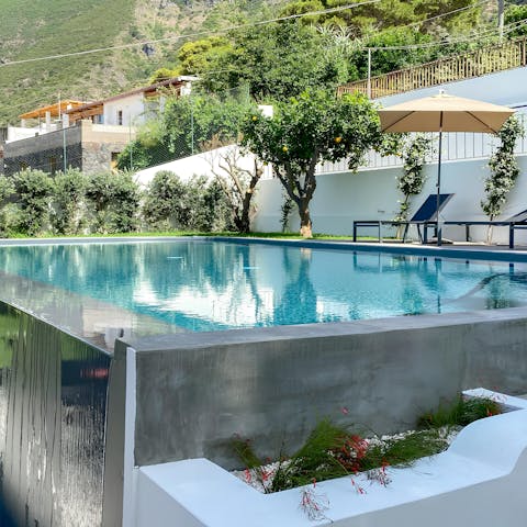 Cool off in the private pool amid citrus trees and sweeping views
