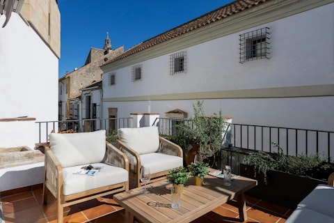 Watch the Bell Tower rise overhead as you unwind with a glass of wine