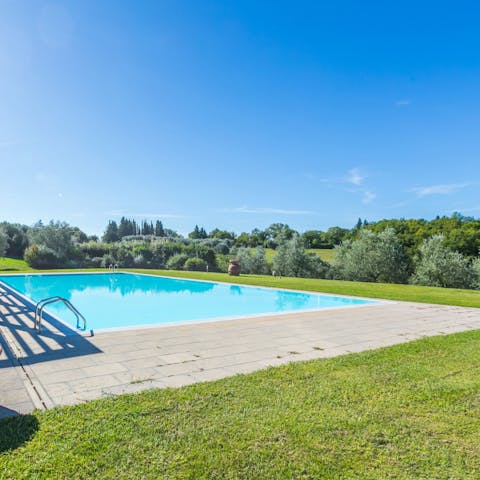 Admire countryside views from the shared swimming pool