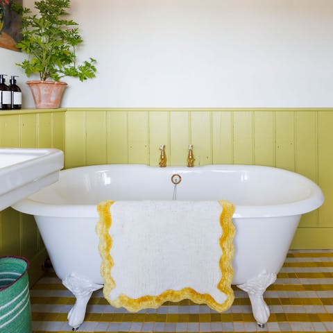 Take a relaxing soak in the freestanding roll-top bath
