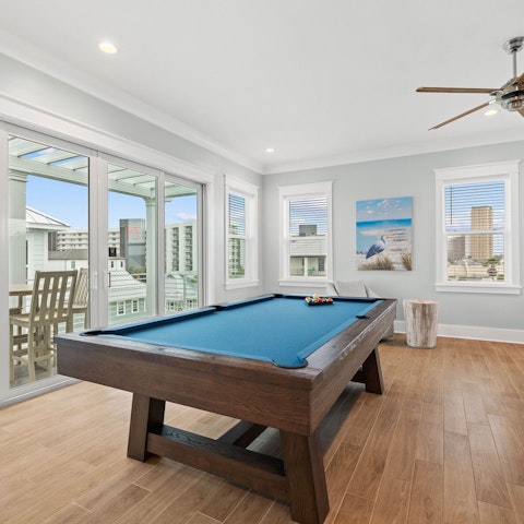 Keep everyone entertained with the pool table and bar