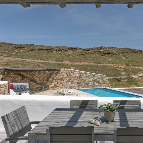 Enjoy an alfresco meal with views of the Greek countryside
