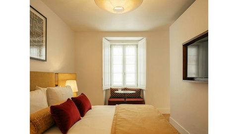 Wind down in a calm bedroom with a window nook