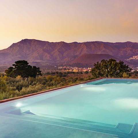 Take a twilight dip in the stunning swimming pool