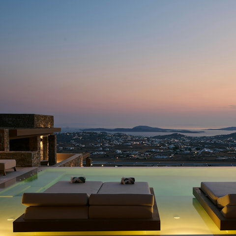 Unwind in the infinity pool with a view of the town and coast