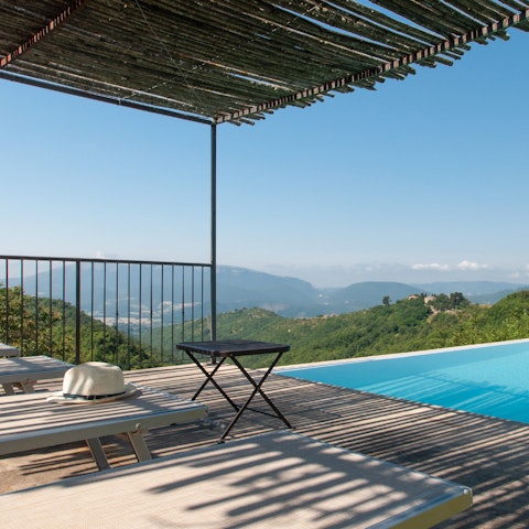 Soak in the sweeping valley vistas from the shady pergola