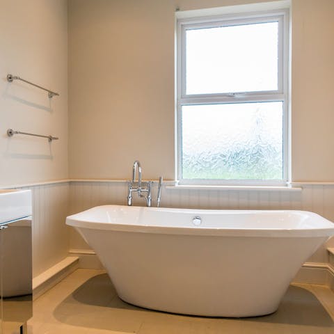 Make time for a long soak in the freestanding bathtub