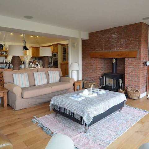 Stoke the wood-burning stove to keep things warm and cosy