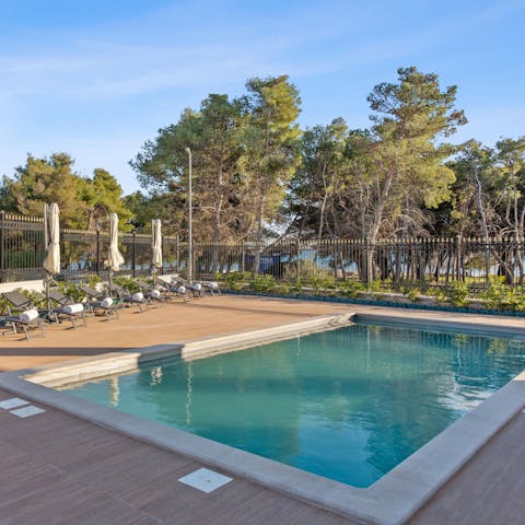 Find a sunny spot by the pool for a slow-paced afternoon