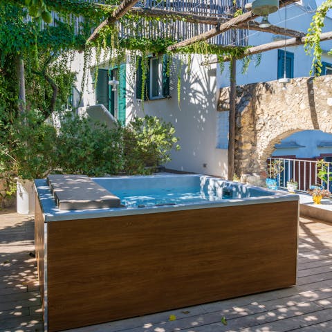 Unwind in the hot tub under the Mediterranean sunshine