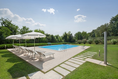 Savour the sunshine from the lounger-lined swimming pool