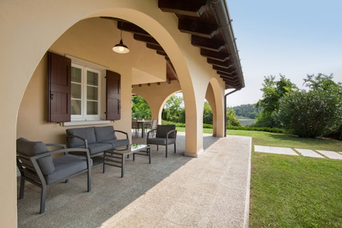 Find a spot on the shaded terrace to relax with a glass of local wine