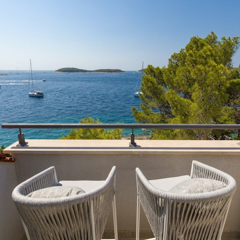 Gaze out to sea and to the Pakleni Islands with a cocktail