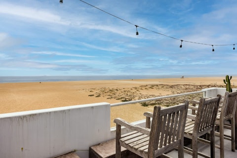 Pour a glass of something chilled and unwind on the balcony