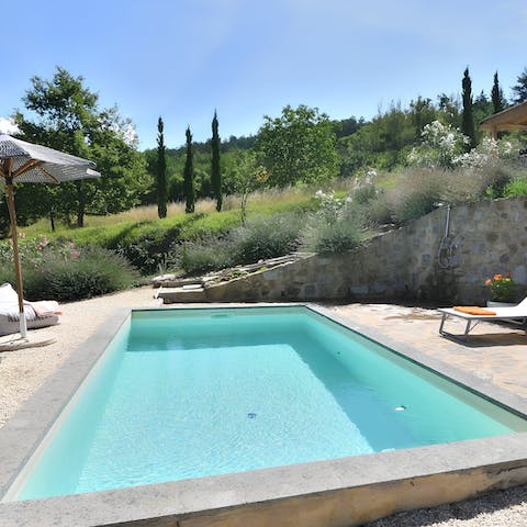 Soak up the sunshine on a lounger before cooling off in the pool